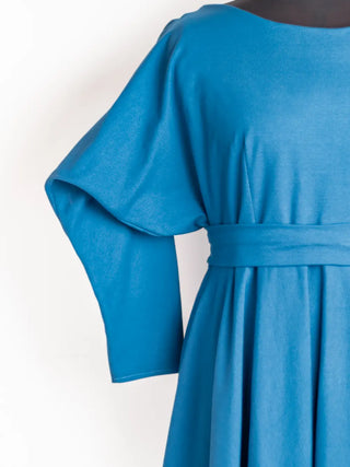 Close-up of the Blanche Dress sleeve and bodice – showcasing wide kimono-style sleeve, soft pleats, and smooth stretch cotton fabric in deep teal. Handmade by Cori Tailor.