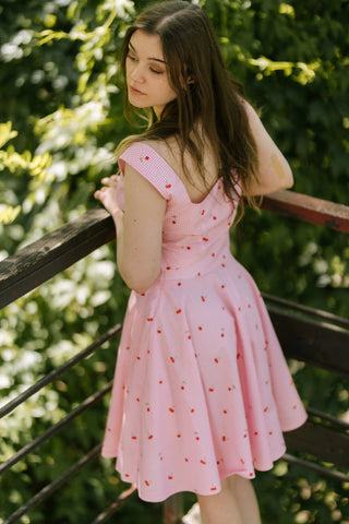 Back view of the Lolita Top by Cori Tailor, pink gingham cotton with cherry print, deep V-back design — vintage-inspired summer top.