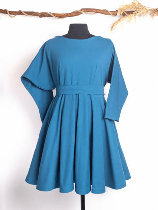 Front view of the Blanche Dress by Cori Tailor in deep teal – vintage-inspired design with wide flutter sleeves, full circle skirt, and a cinched waist for a dramatic silhouette.