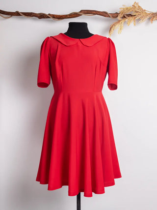 Front view of the Sophia Dress in vibrant red, featuring a Peter Pan collar, softly gathered puff sleeves, and a full circle skirt. Vintage-inspired and handmade by Cori Tailor.